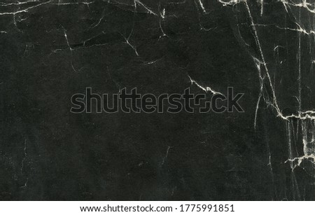 photo texture of old paper in black hue Royalty-Free Stock Photo #1775991851