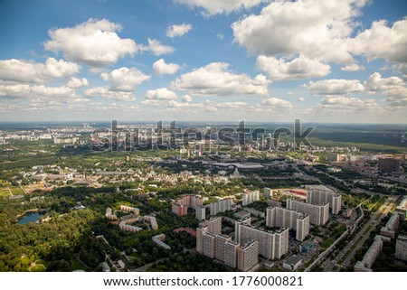 Office buildings and apartment buildings rise above the city streets of Moscow, Russia as seen from an aerial view.