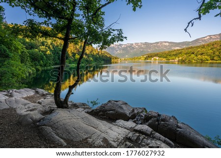 View of the beautiful Lake Monticolo in the morning in the municipality of Eppan in Italian South Tyrol.