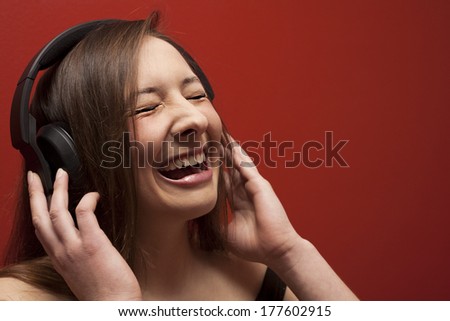 Young woman with headphones listening music
