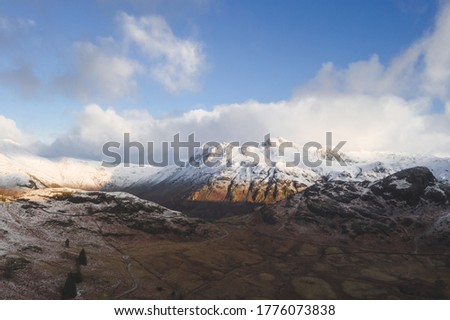 snowy mountain peaks lake district UK winter landscape drone photography