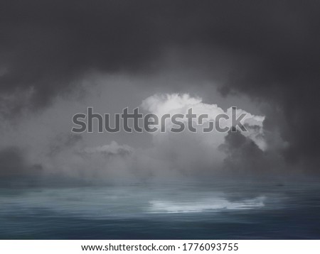 natural background with stormy clouds in black and white in sea reflection 