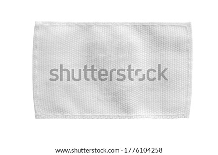 White blank laundry care clothes label isolated on white background Royalty-Free Stock Photo #1776104258