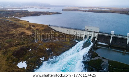 sustainable hydropower plant on a reservoir Royalty-Free Stock Photo #1776117425
