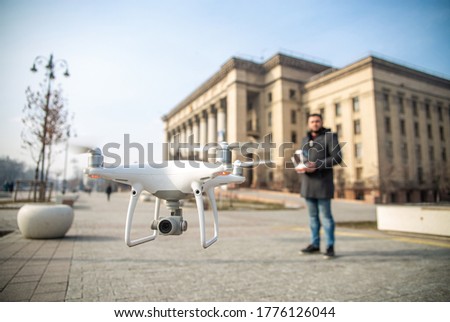 copter in the city on the background of the operator Royalty-Free Stock Photo #1776126044