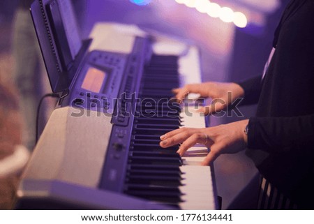 man playing the piano during a concert
