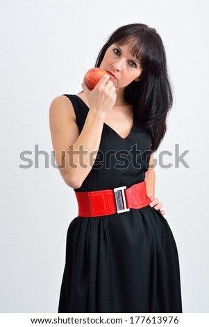 Woman with a red apple in the hand