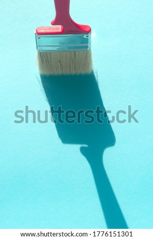 brush for painting on a blue background. Repair concept.