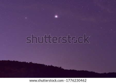 Jupiter and Saturn planets  in the night sky.
