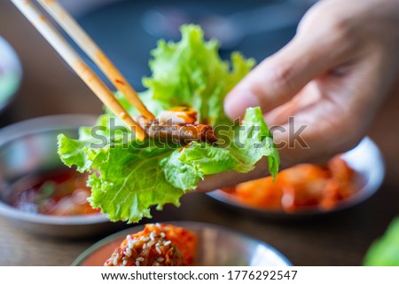 eat BBQ grilled pork with vegetable wrap korean style,Barbecue Royalty-Free Stock Photo #1776292547