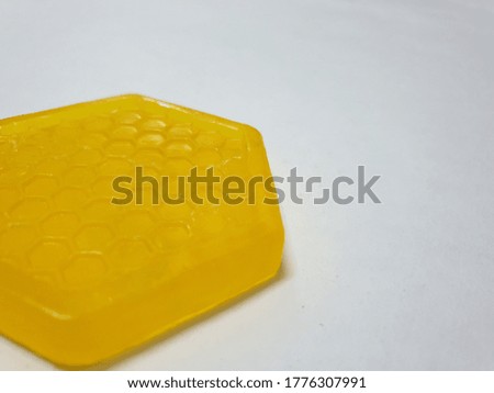 Yellow honey soap on a white background