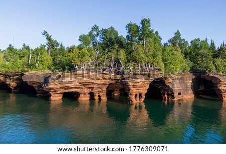 Rocky Shores of the Apostle Islands National Lakeshore Near the Wisconsin Shoreline of Lake Superior Royalty-Free Stock Photo #1776309071