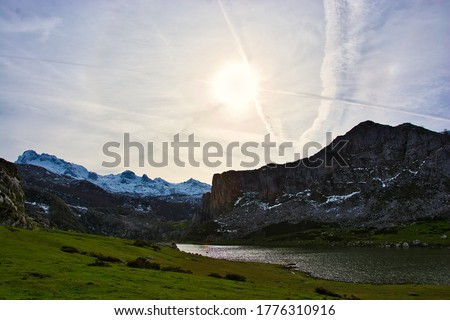 Landscape of a lake at the foot of the mountain in a sunny day