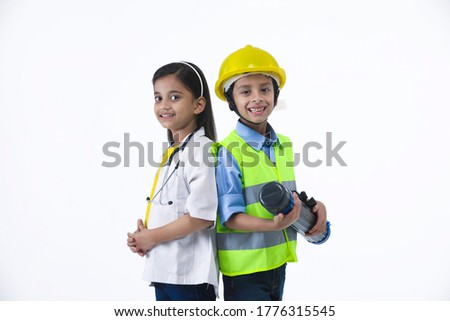 Nurture their interests- Child dressed as engineer and doctor