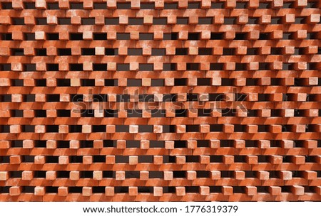 Wall with terra cotta bricks are constructed with spaces between layers.  Design, material, building, decoration and renovation ideas.   