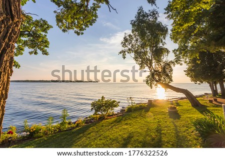 Sunset Over Lake Michigan and Garden Landscape Royalty-Free Stock Photo #1776322526