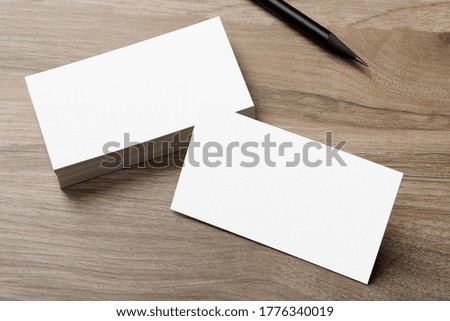 Minimal business card mockup on wooden desk