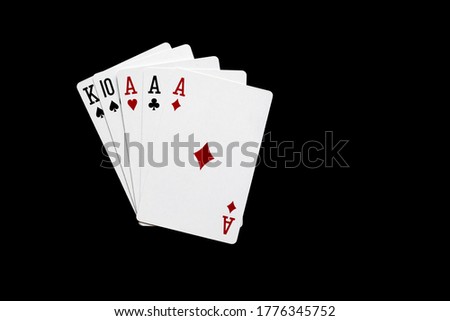 Three of a kind combination in poker on black background. Poker  combinations concept.