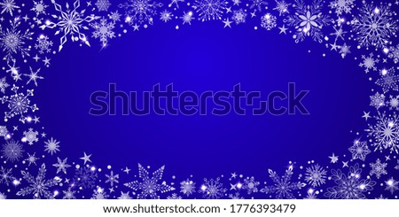 Christmas background with various complex big and small snowflakes, white on blue, arranged in a ellipse