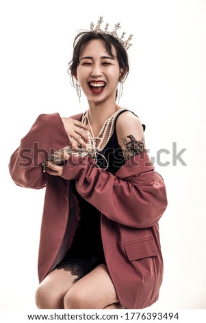 Beautiful Asian fashion woman holding pearl necklace jewelry