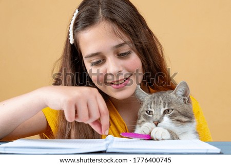 Coronavirus. Quarantine. Home training education and freelance work. Cat and girl studying remotely. Coronavirus pandemic world. Social distancing, work from home, stay home concept, home office