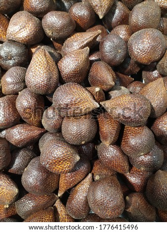 A Group of Thorny Palm Fruit