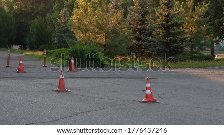 Traffic cones in the Parking lot in front of the store.
