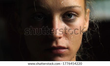 Sweaty Woman Looking at the Camera, Close-up Royalty-Free Stock Photo #1776454220