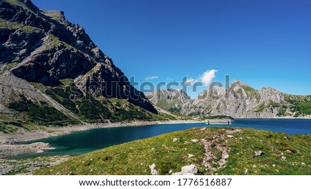 Beautiful panoramic view of Lunersee is a large alpine lake high above Brandnertal in the Austrian State of Vorarlberg. Set amidst the striking limestone mountains One of the largest natural mountain Royalty-Free Stock Photo #1776516887