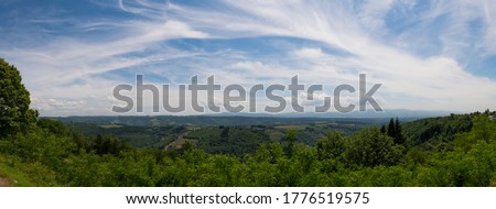 Typical Southern French Country Side Panorama in Bright Colors with Gorgeous Curly Roads and Village with Church in Background Wallpaper Colorful 