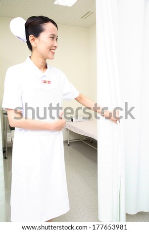 Japanese Nurse opening the curtain