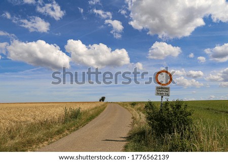 Summer Landscape. Text on the plate in german: agricultural vehicles only.