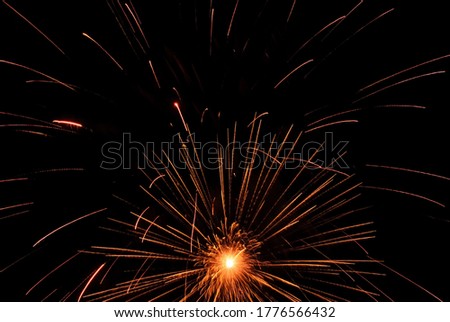 Sparkling fireworks display against the night sky. abstract background for celebration merry christmas, birthdays, Victory Day, independence, holidays, celebration, party, festival, new year concept