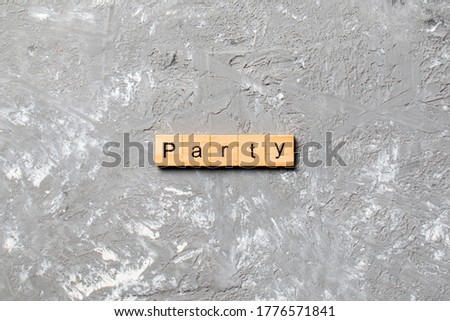 PARTY word written on wood block. PARTY text on cement table for your desing, concept.