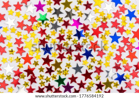 festive background with a pattern of multicolored stars