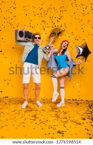 Vertical full length body size view of nice attractive cheerful excited glad couple dancing having fun disco leisure entertainment isolated bright vivid shine vibrant yellow color background