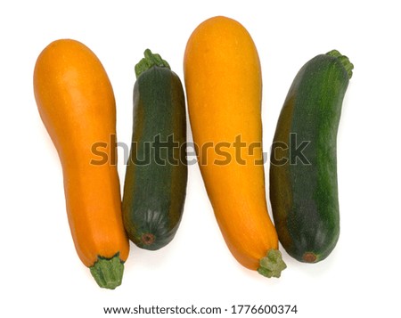 Fresh zucchini in closeup on a white background