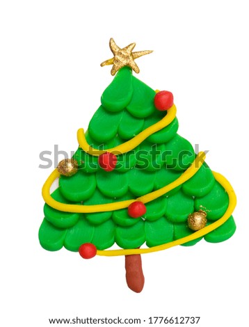 Plasticine christmas tree with star isolated on white background. Gold and red christmas ball. Kids artwork.