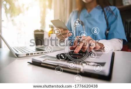 Doctor working in hospital use calculator, Healthcare and medical concept.