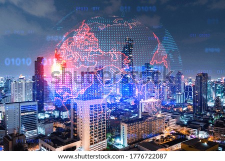 Hologram of Earth planet map on night panoramic cityscape of Bangkok, Asia. The concept of international companies. Multi Exposure.