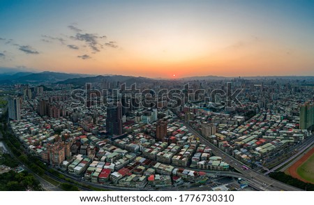 Taipei City Aerial View - Asia business concept image, panoramic modern cityscape building bird’s eye view under sunrise and morning blue bright sky, shot in Taipei, Taiwan