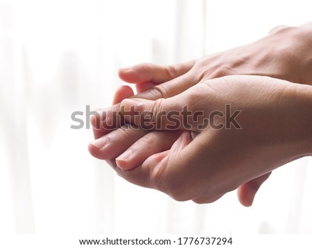 Close-up of finger massage with hand pain joint and numb.