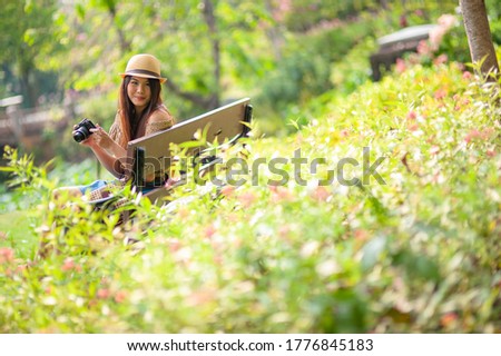 attrative girl take her leisure weeked for taking picture in the park