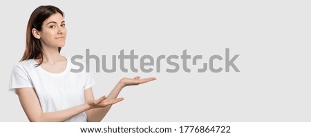 Promotional background. Ad text. Confident woman isolated demonstrating neutral empty space.