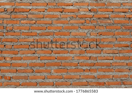 unfinished concrete red brick wall abstract background