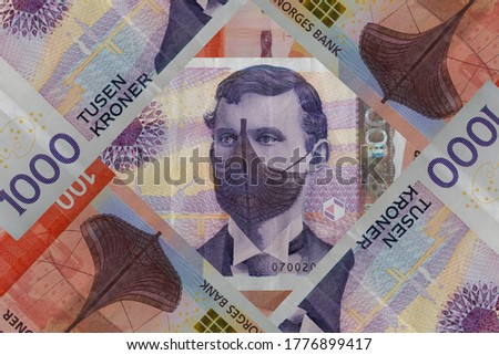 Norwegian krone with protective face mask. Covid-19 affect on financial system in in Norway. Royalty-Free Stock Photo #1776899417