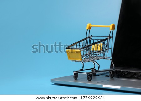 an empty shopping cart on a laptop computer. symbolic photo for shopping on the internet