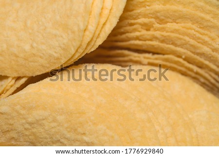 Background. Crispy potato chips. Close-up.