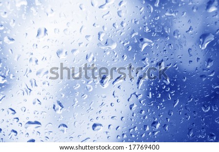 photo of drops on blue glass