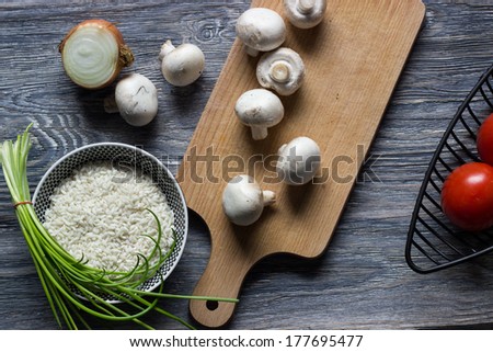 rice with mushrooms on wooden table